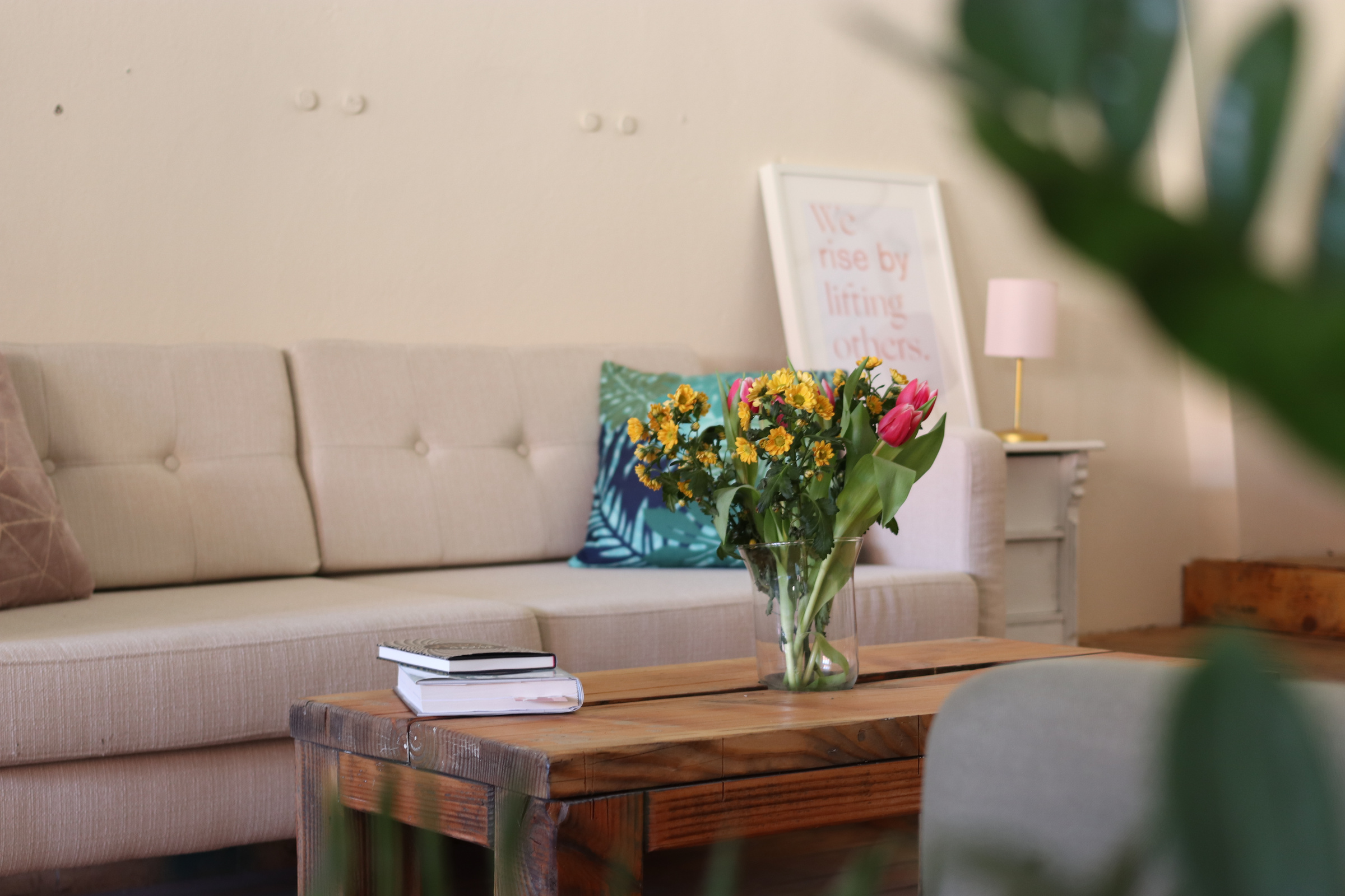 Yellow-petaled Flowers in Vase on Top Of Brown Wooden Table